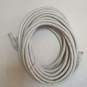 NEXA 5-meter grey copper Cat6 UTP patch cord routed through a cable manager to connect networking equipment across a server rack.